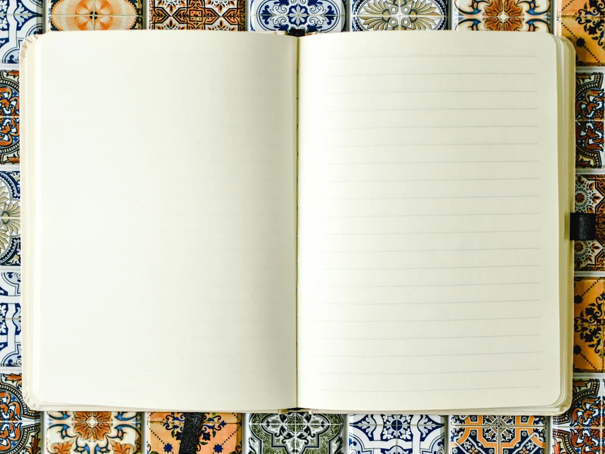 An open notebook with ruled pages.