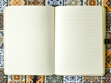 An open notebook with ruled pages.